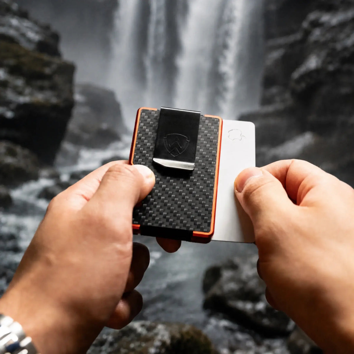 Axwell carbon fiber wallet carried beside a campfire
