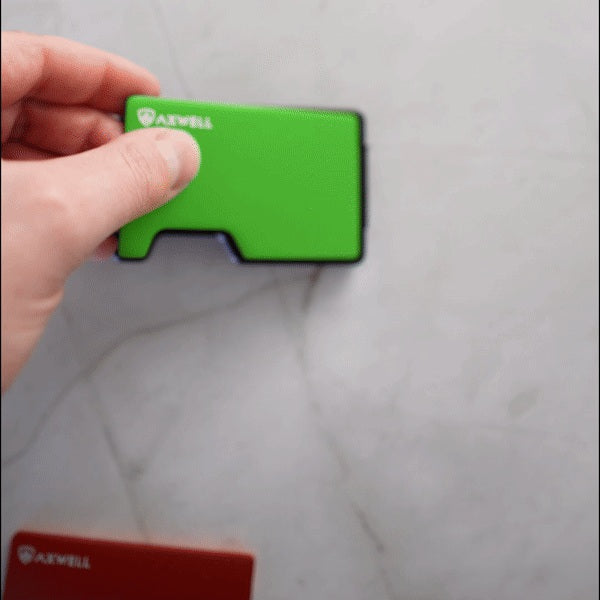 Hands remove an Axwell magnetic cover plate and attach a different color without tools.